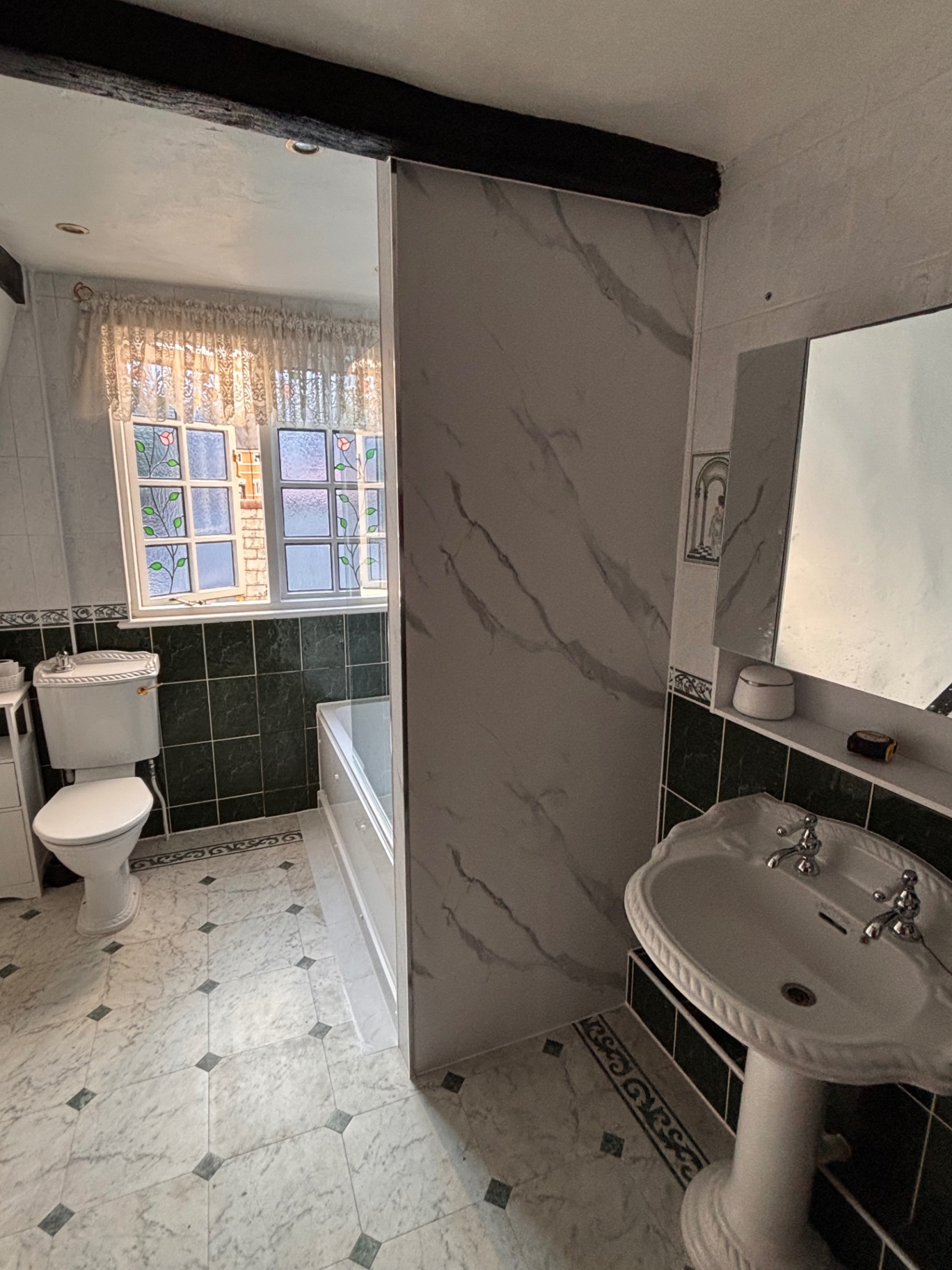 Bathroom refresh with white marble-effect shower wall panels